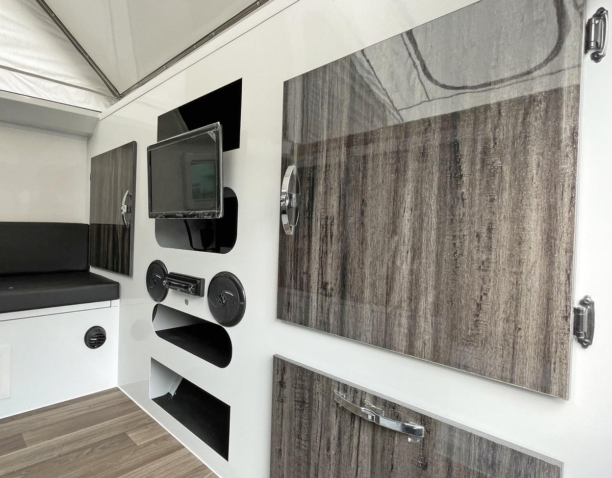  and a comfortable bed. Perfect for camping!|This grey and black rv rental pop-up camper is set up outdoors with an extended awning — photo 5