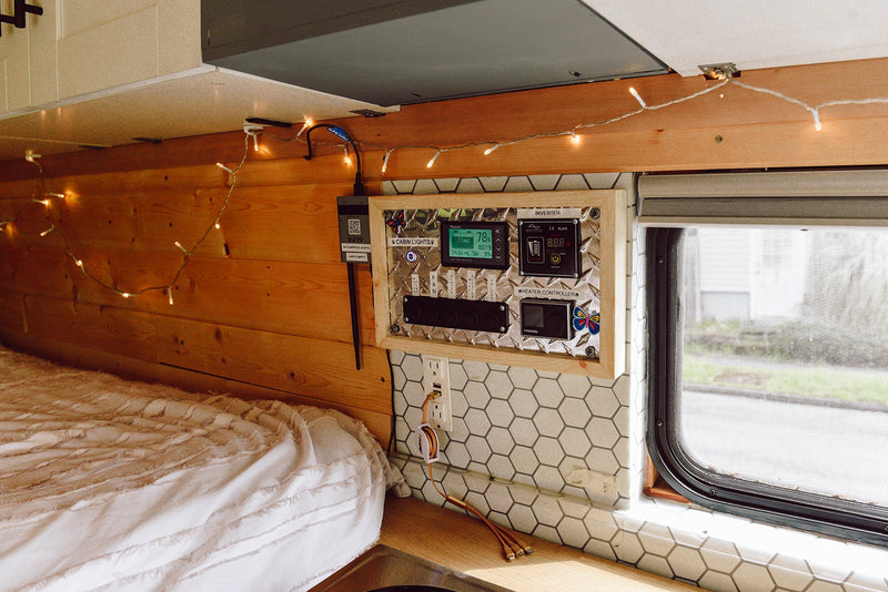  and kitchenette with sink/cooktop.|This white Ram ProMaster converted camper van — photo 5