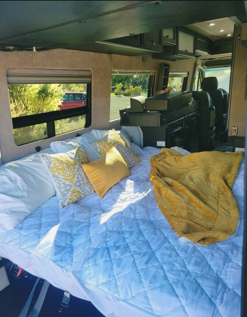  and scenic nature view from the rear.|Spacious RV rental interior with kitchenette — photo 1