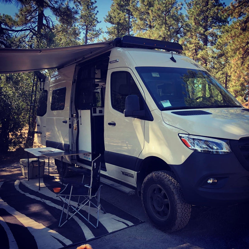  ready for adventure.|RV rental camper van at a wooded campsite — photo 11