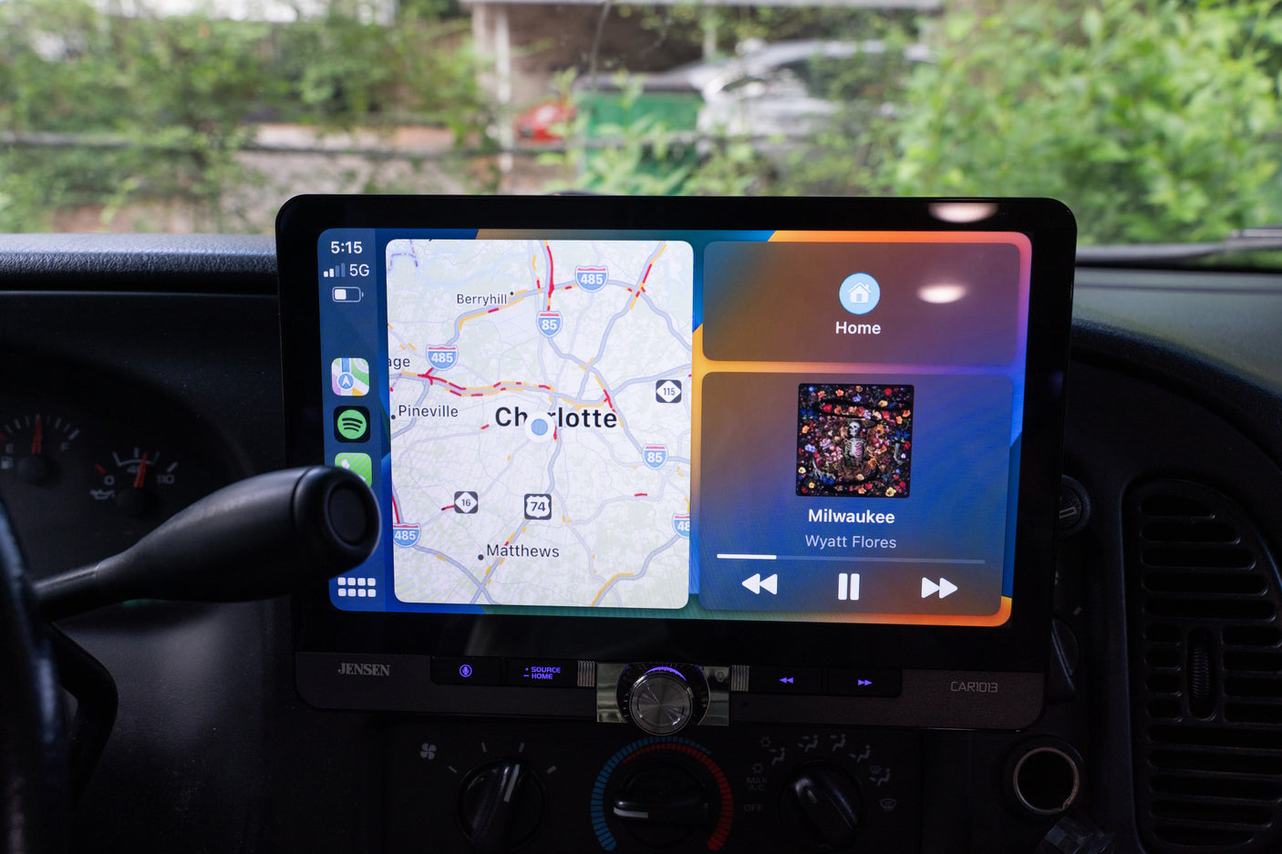 Enhance your rv rental journey with this dashboard screen featuring CarPlay navigation for Charlotte and music playback.