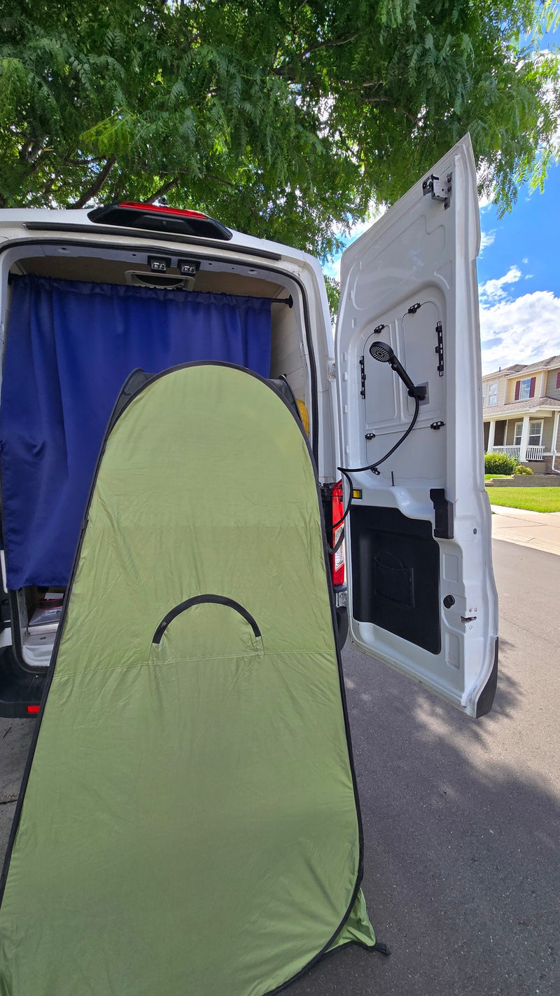 RV rental ready for adventure: van with blue curtain, outdoor shower, and green privacy tent for privacy. — photo 16