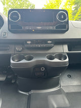 RV rental van cockpit: touchscreen, climate control, start/stop button, USB ports, and cup holders for your journey.