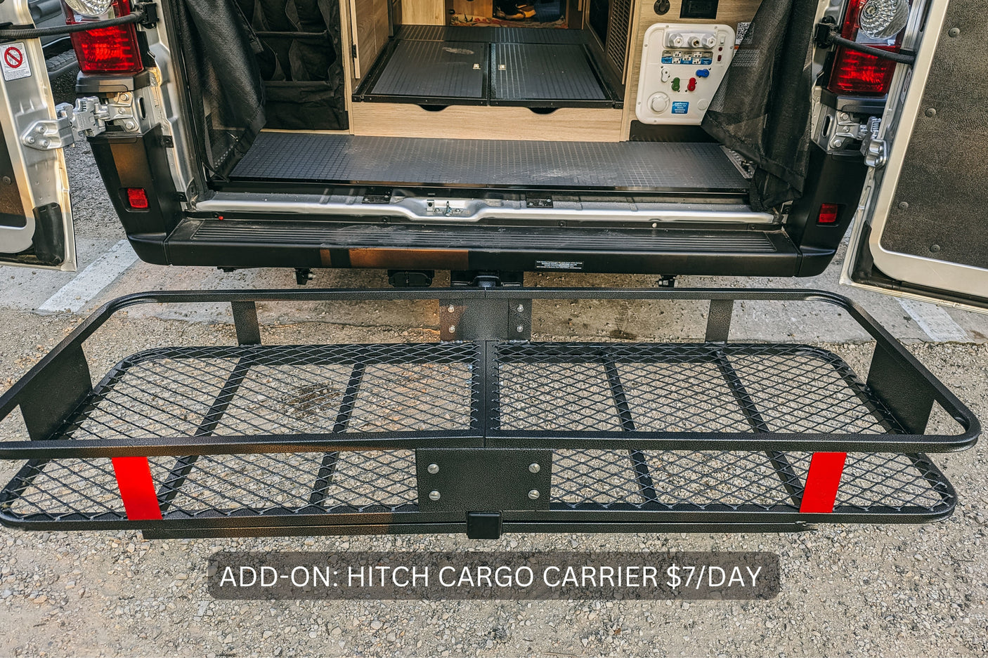 RV rental: Rear of van showing interior storage & optional hitch cargo carrier (add-on $7/day) for extra gear.