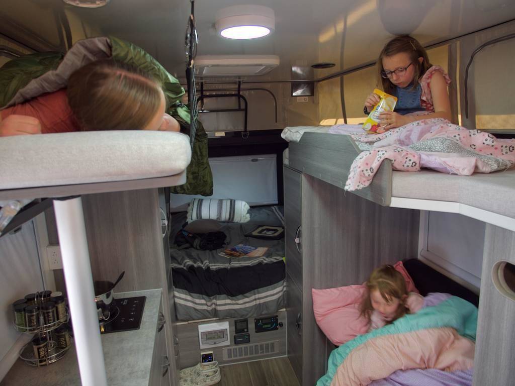  and clever storage solutions. Comfortable travel awaits.|Spacious RV rental interior: a modern kitchen — photo 12