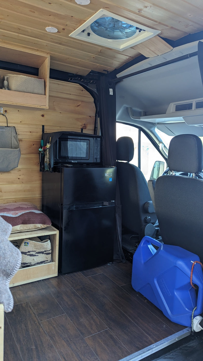  with ambient lights & forest views.|This cozy rv rental's interior shows wood walls — photo 3