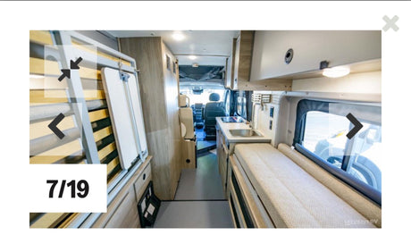 Explore this RV rental's interior: compact kitchen, bed/lounge area, and driver's cabin layout for road trips.