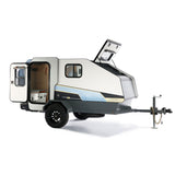 A compact, white/grey overland camper trailer, doors open. Ideal rv rental for rugged outdoor adventures.