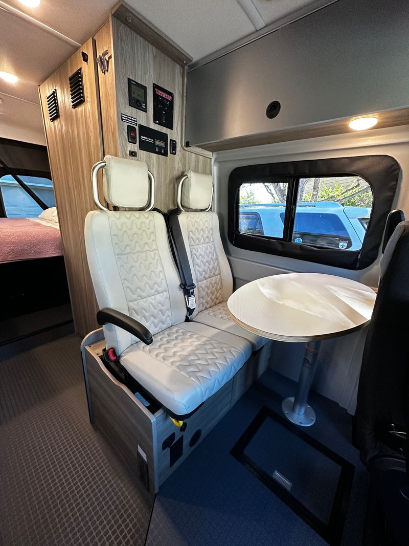  ideal for travel.|View inside an RV rental: Rear bed and integrated utility panel with water and power connections — photo 10