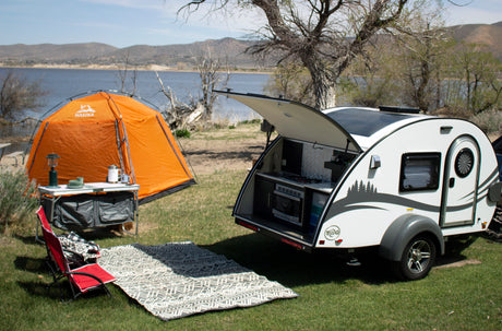 Perfect RV rental getaway: Teardrop camper, tent, outdoor kitchen set up for lakeside camping.