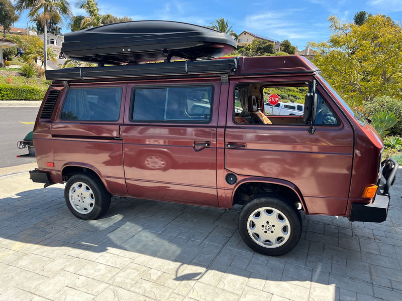 perfect for an RV rental adventure.|Back view of a maroon Westfalia camper van with spare tire — photo 3
