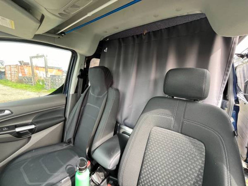  showing under-bed area with a bubble-wrapped pillow and gear bags.|This RV rental's clever interior features a convertible bed — photo 5