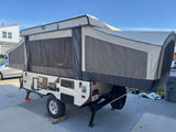 This Comet Starcraft pop-up camper, ideal for an rv rental, is extended and ready for your next camping adventure.