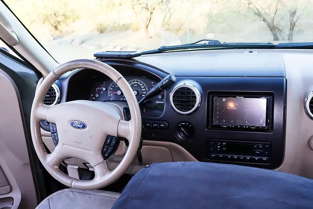 RV rental interior: A car transformed into a comfortable sleeping space with a bed — photo 16