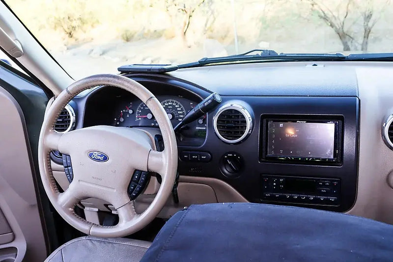 RV rental interior: A car transformed into a comfortable sleeping space with a bed — photo 16