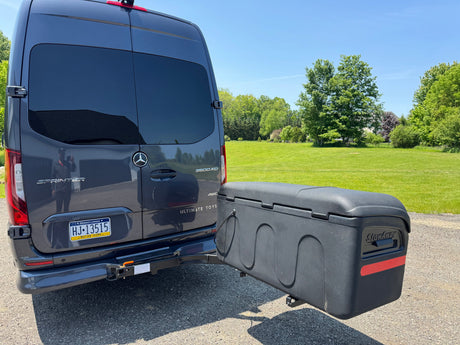 This Mercedes Sprinter RV rental, an Ultimate Toys motor home, features a StowAway cargo box on its rear hitch.