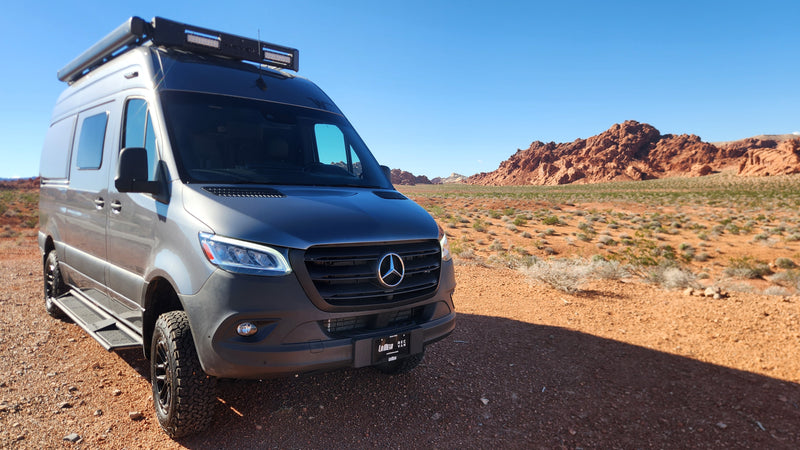 Grey Mercedes Sprinter rv rental van in a scenic desert with red rock mountains and a clear blue sky. — photo 5