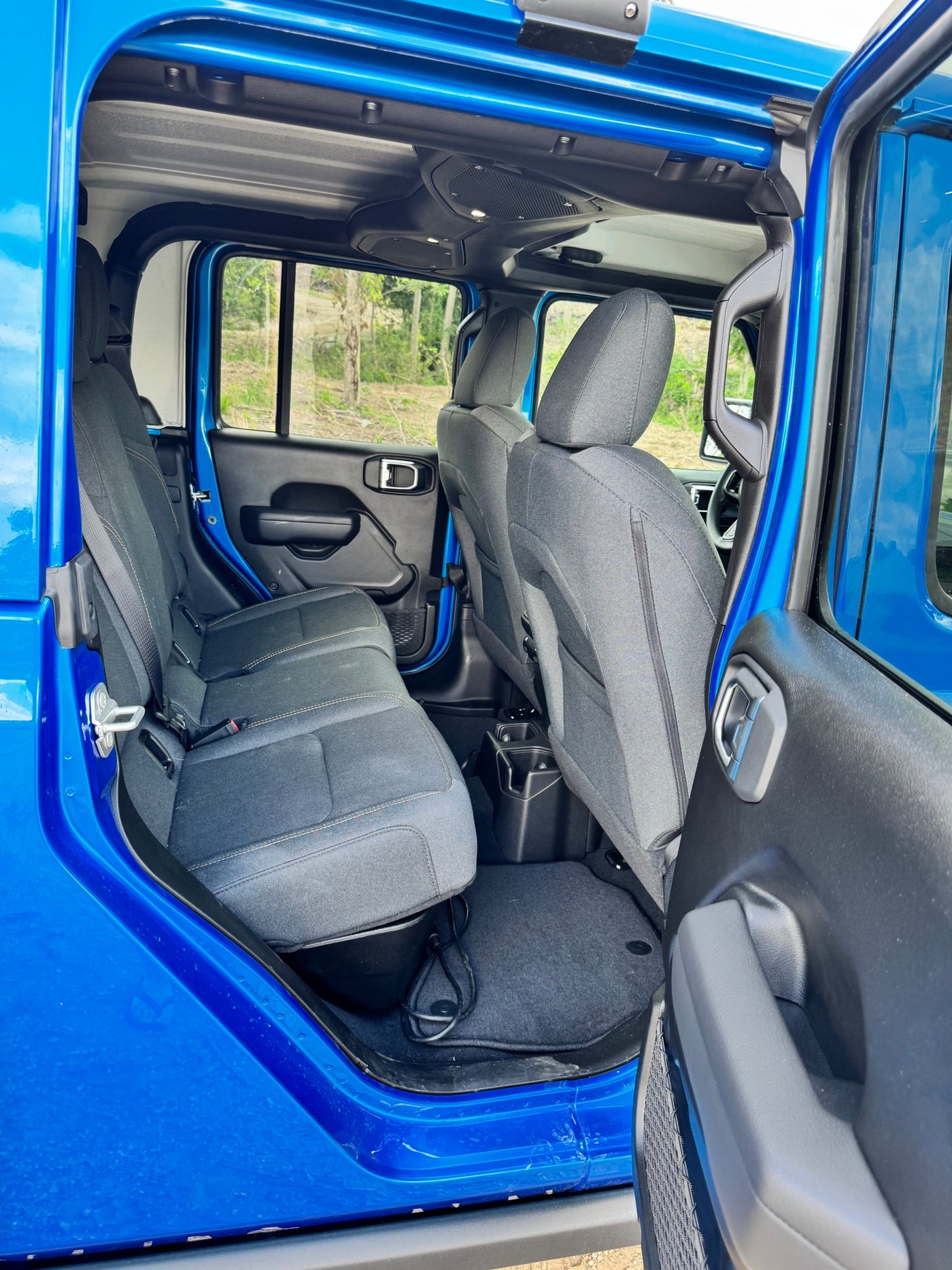  and large screen. Ideal for RV rental trips.|Spacious rear interior of a blue SUV — photo 12