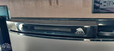 Close-up of a Norcold RV refrigerator's control panel, showing a digital display with power, 'A' mode, and temperature bars. Ideal for rv rental.