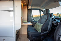  and open view to a desert landscape featuring Joshua trees.|RV rental interior: kitchen (microwave — photo 10