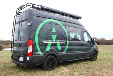 This unique adventure van, branded "Adventure Rig Rentals" with green topo lines, is an ideal rv rental.