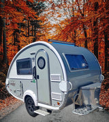 Explore fall foliage with this nuCamp teardrop camper RV rental. Ideal for a cozy outdoor adventure.