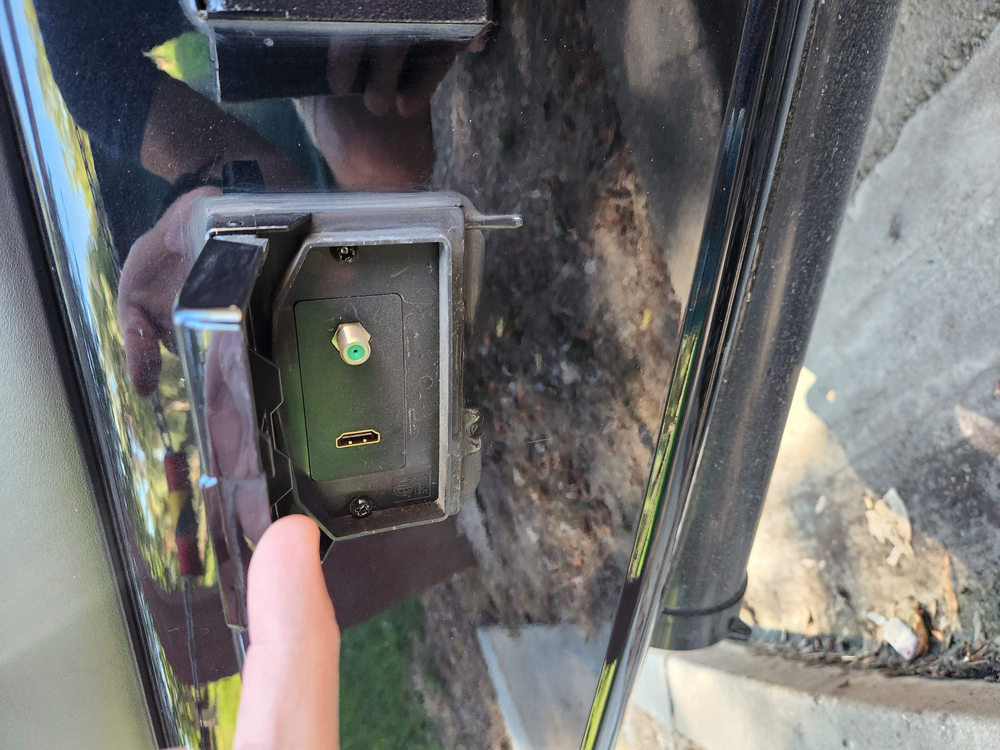 Outdoor RV entertainment bay with coaxial and HDMI ports, common for RV rental hookups.