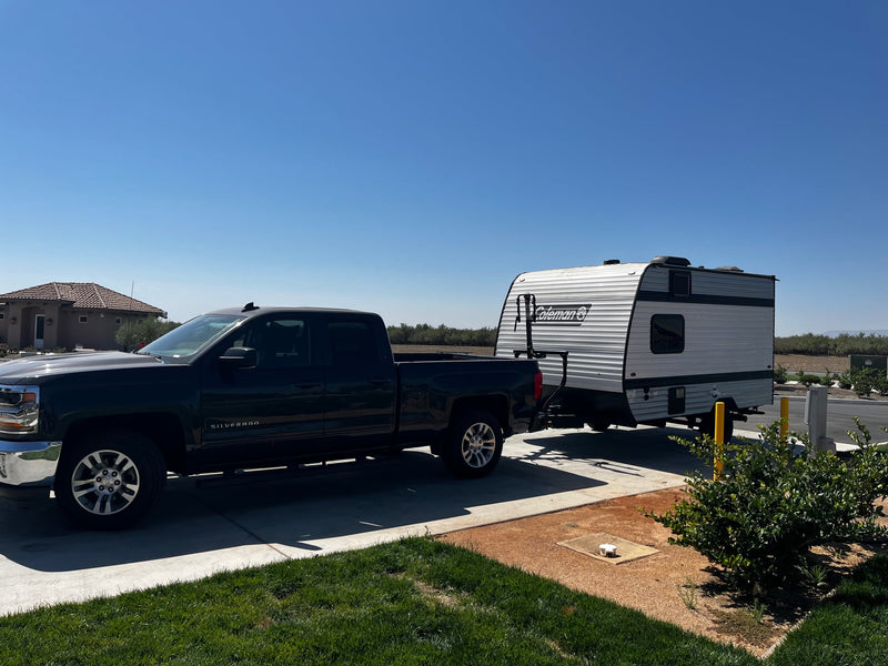  and a rug for outdoor relaxation.|Coleman travel trailer RV rental with extended awning — photo 6