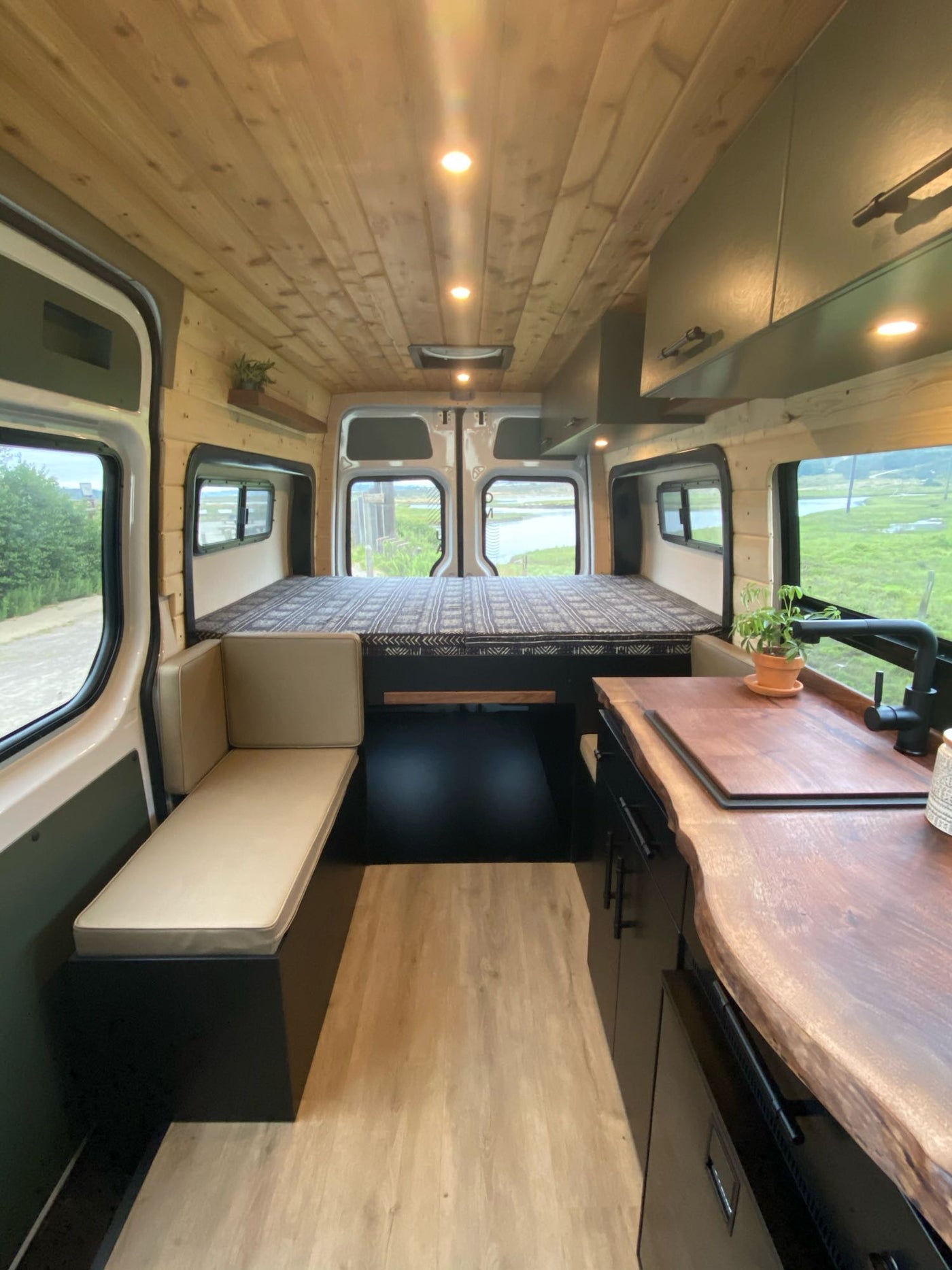  by sandy hills & mountains. Ideal for outdoor adventure trips.|Step inside this modern camper van RV rental — photo 3