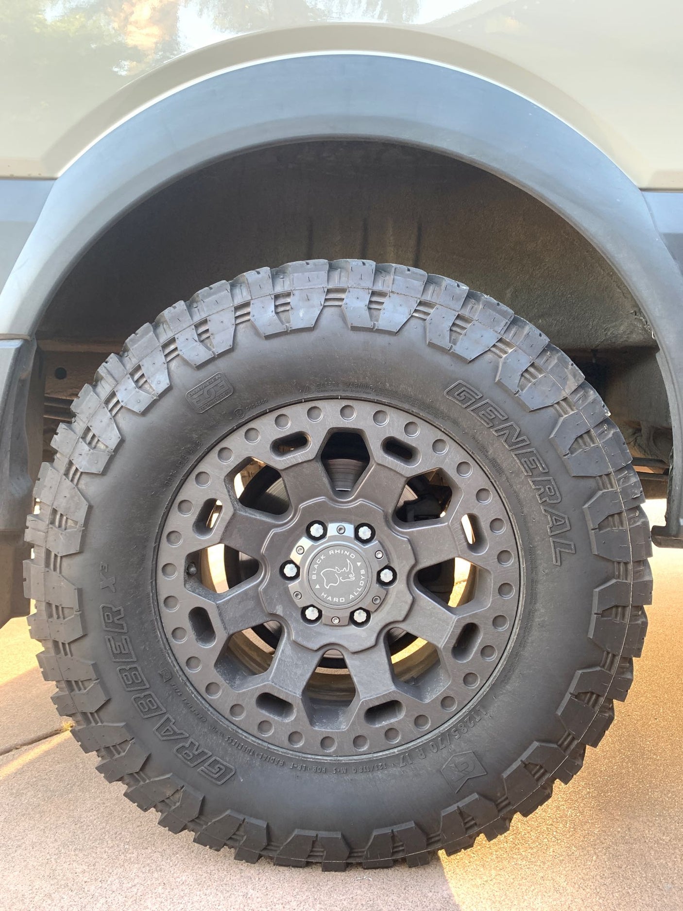 Rugged General Grabber X3 tire and Black Rhino wheel on an RV rental, ready for adventure.