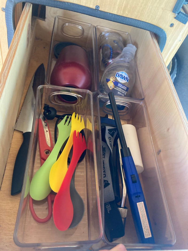  and an adjustable metal storage rack.|**RV rental** van interior: clear view of the dashboard — photo 12