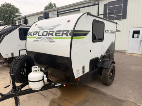 This rugged white and black XPLORER off-road RV trailer, complete with propane tank, is ready for your next rv rental adventure.