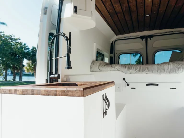  ready for adventure.|Inside this stylish rv rental: a full kitchen with wooden tops — photo 5