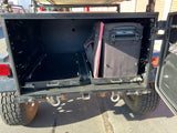 Maximize adventure with this RV rental! Rear storage features pull-out trays, portable fridge, and robust off-road utility.