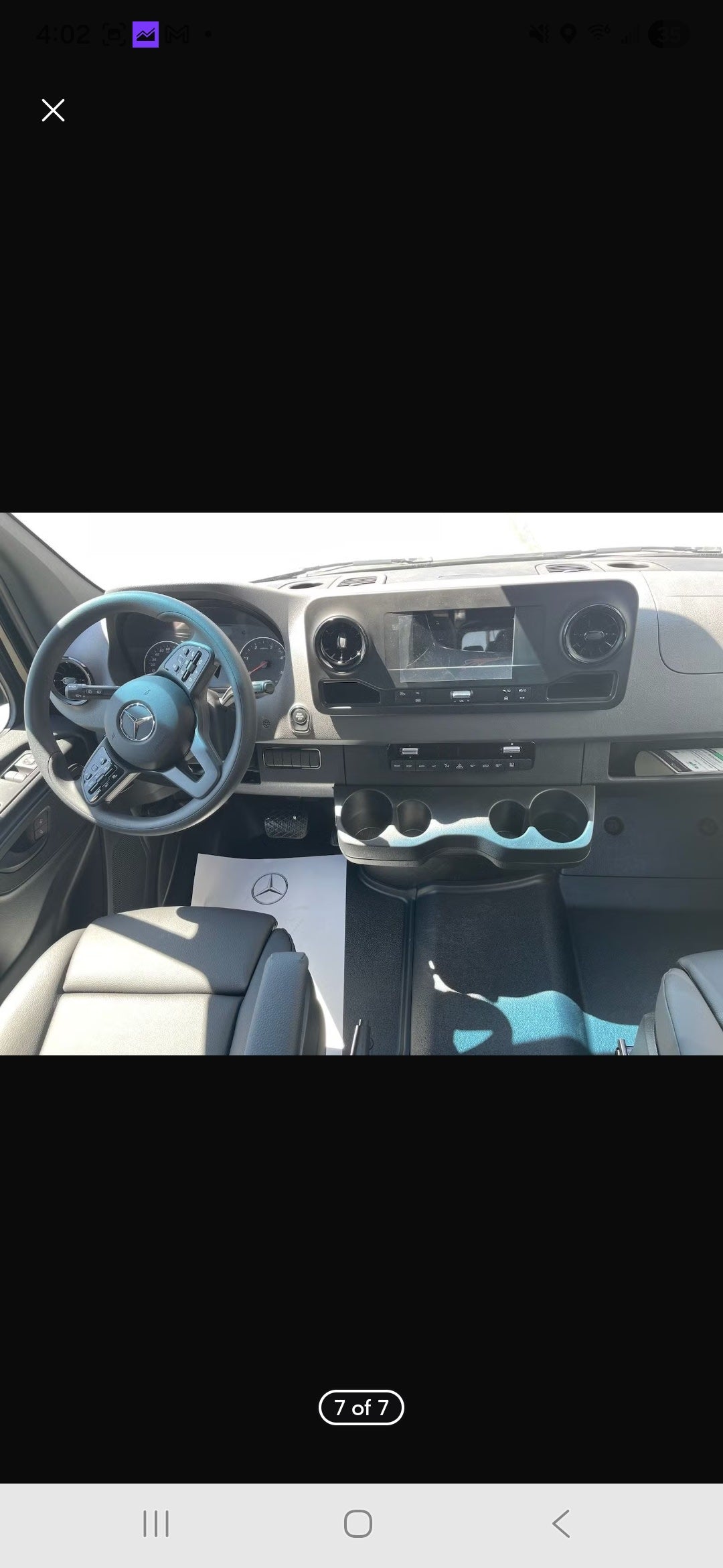 Clean Mercedes-Benz Sprinter van interior for RV rental: dashboard, steering wheel, and front seats are visible. — photo 6