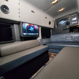 This luxury RV rental offers a spacious interior with Captain America on screen, plush two-tone seating, and custom lighting.