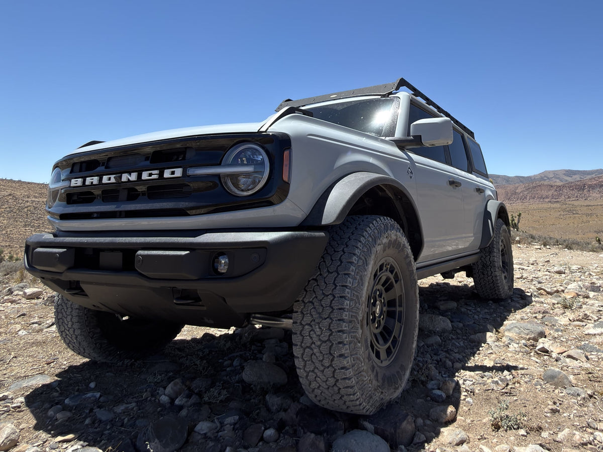  exploring rugged trails. A different adventure than an RV rental.|Adventure-ready Ford Bronco on rocky desert terrain — photo 2
