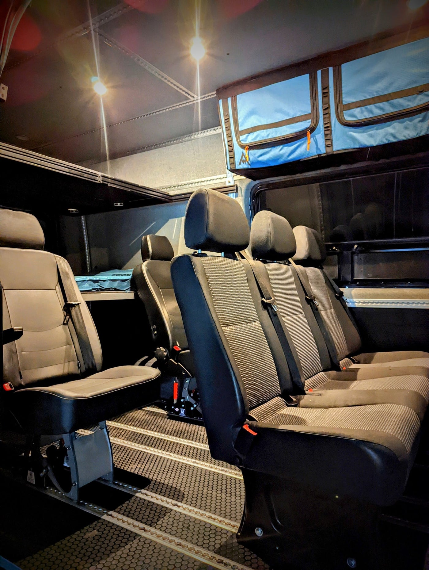  is parked by the ocean.|Gray customized Sprinter camper van — photo 3