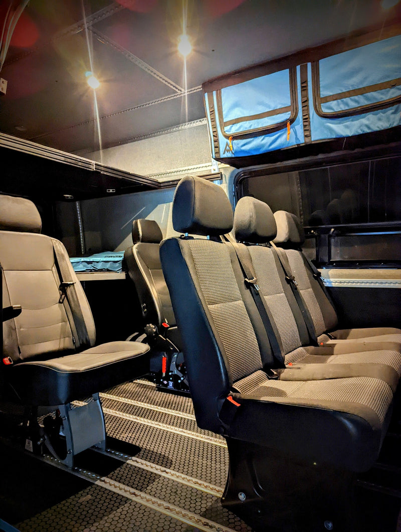  is parked by the ocean.|Gray customized Sprinter camper van — photo 3