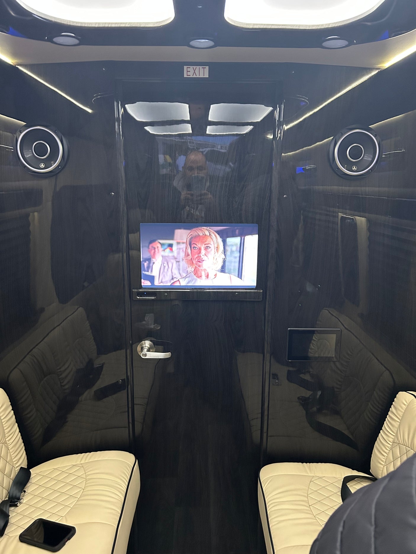 Experience premium comfort in this RV rental's luxurious interior. Features include a TV, JL Audio speakers, and plush seats.