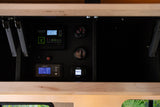 RV rental's essential control panel: Zamp Solar, Xantrex, Webasto, and water gauges manage power & comfort.
