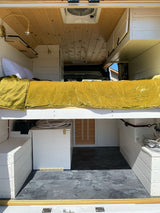 This RV rental interior offers a golden-quilted bed, ample white storage, and wood ceilings. Perfect for travel!
