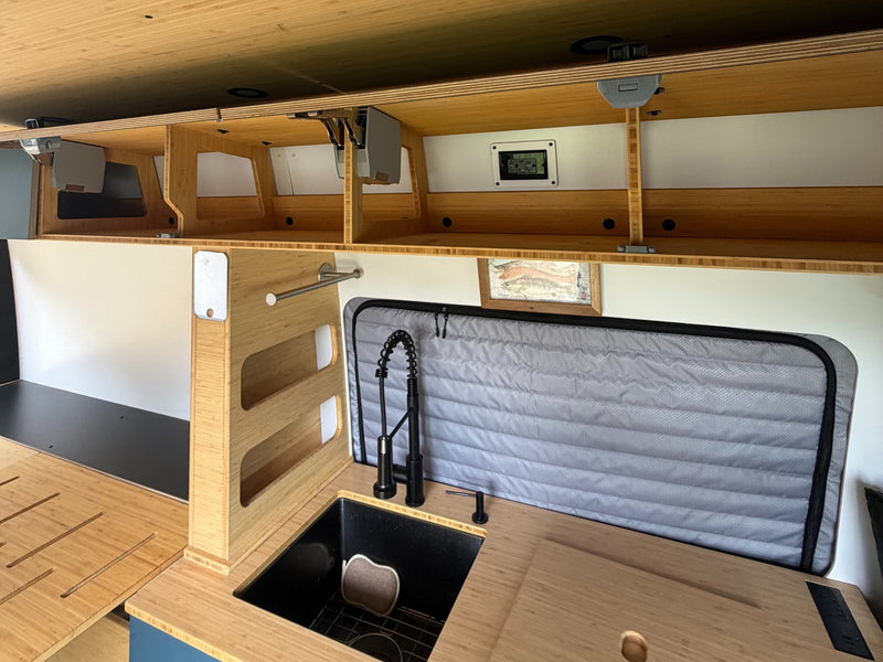  showing custom interior finishes and exterior reflections.|Geotrek camper van RV rental — photo 15
