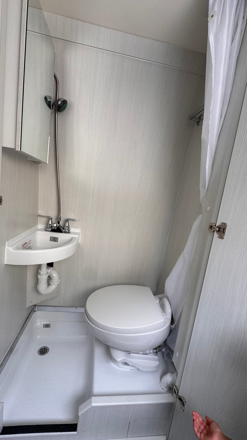  ready for adventure. See front and side.|RV rental's compact wet bath: corner sink — photo 2