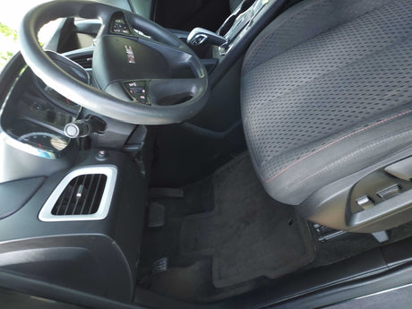 GMC car interior: steering wheel, seat, pedals & console. Explore vehicle types beyond an RV rental.