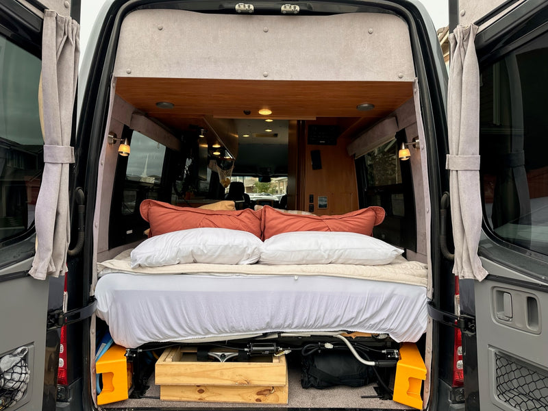  and ocean views. A cozy mobile office setup.|RV rental: Compact kitchen featuring a stove — photo 16