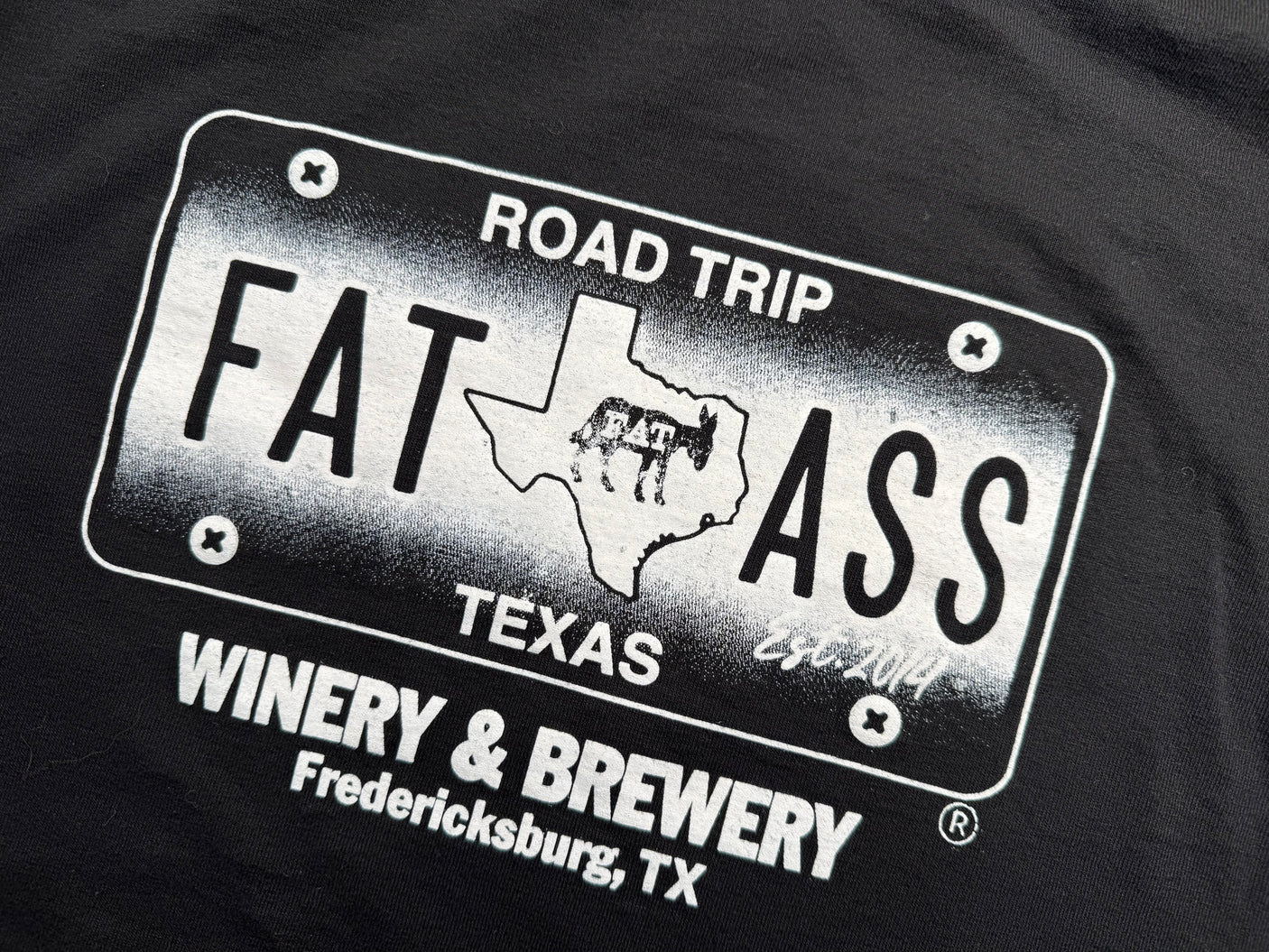 Black t-shirt: "ROAD TRIP FAT ASS TEXAS" license plate graphic, featuring donkeys & "Winery & Brewery Fredericksburg, TX". Great for an RV rental adventure!