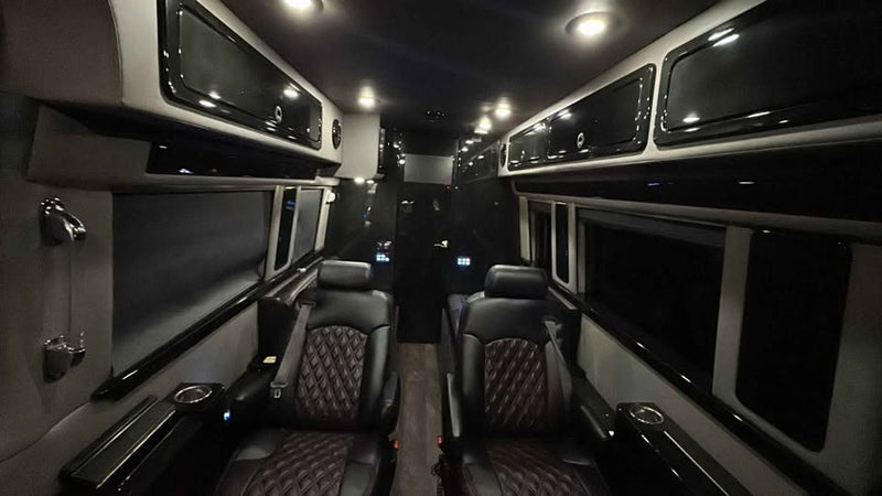  parked in a residential driveway at dusk.|Experience comfort in this RV rental's interior — photo 5
