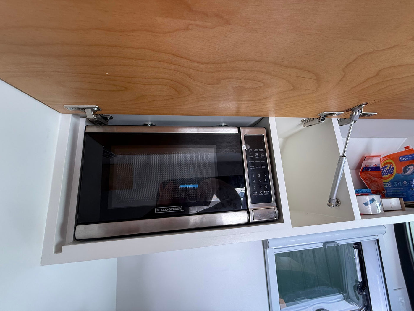  showcasing its modern interior kitchen & seating — photo 2
