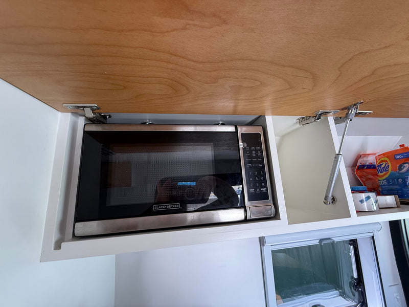 showcasing its modern interior kitchen & seating — photo 2